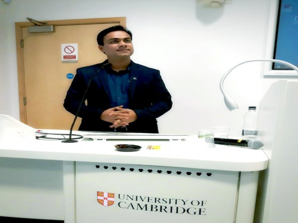 Dr. Tarik is delivering a lecture at the University of Cambridge
